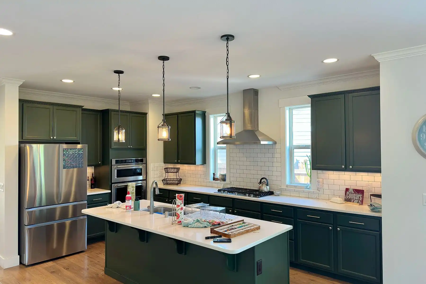Kitchen cabinets repainted deep green by Hilltop Painting in Bellingham, WA